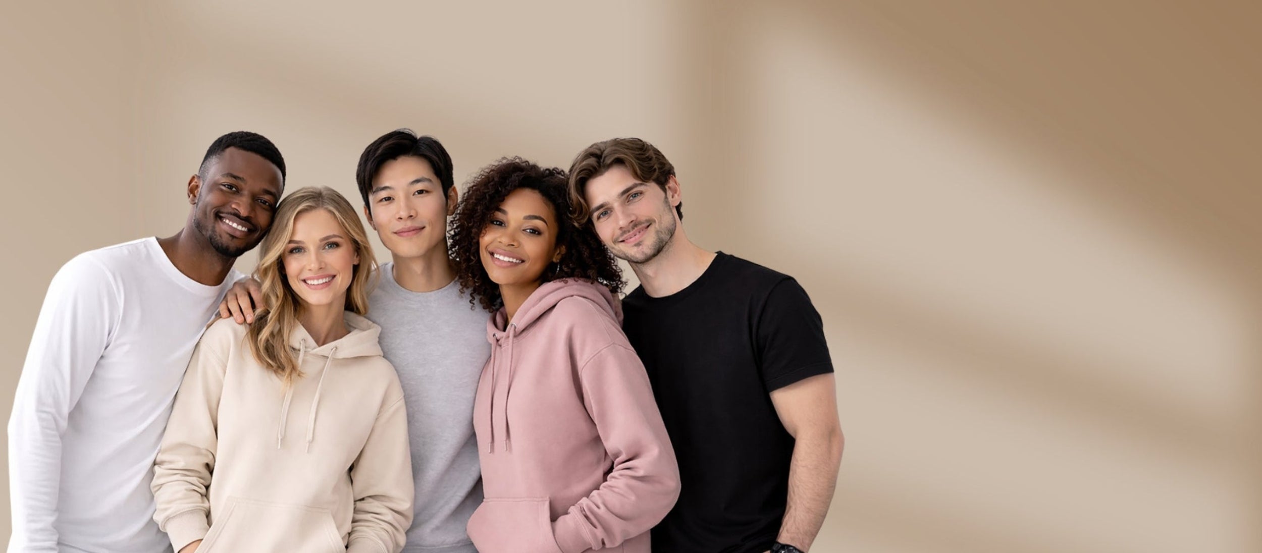 Five people posing together against a beige background
